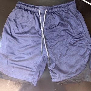 New men’s athletic shorts. Size Medium in the color Blue